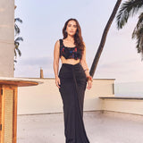 Kusha Kapila in the Noir draped skirt